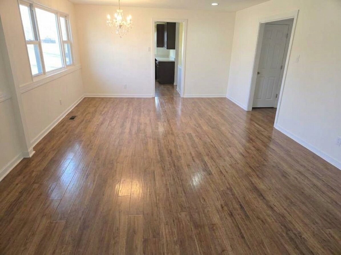 Occupied rental living room full of the tenant's furniture, then the same room emptied by Unstager — after unstaging